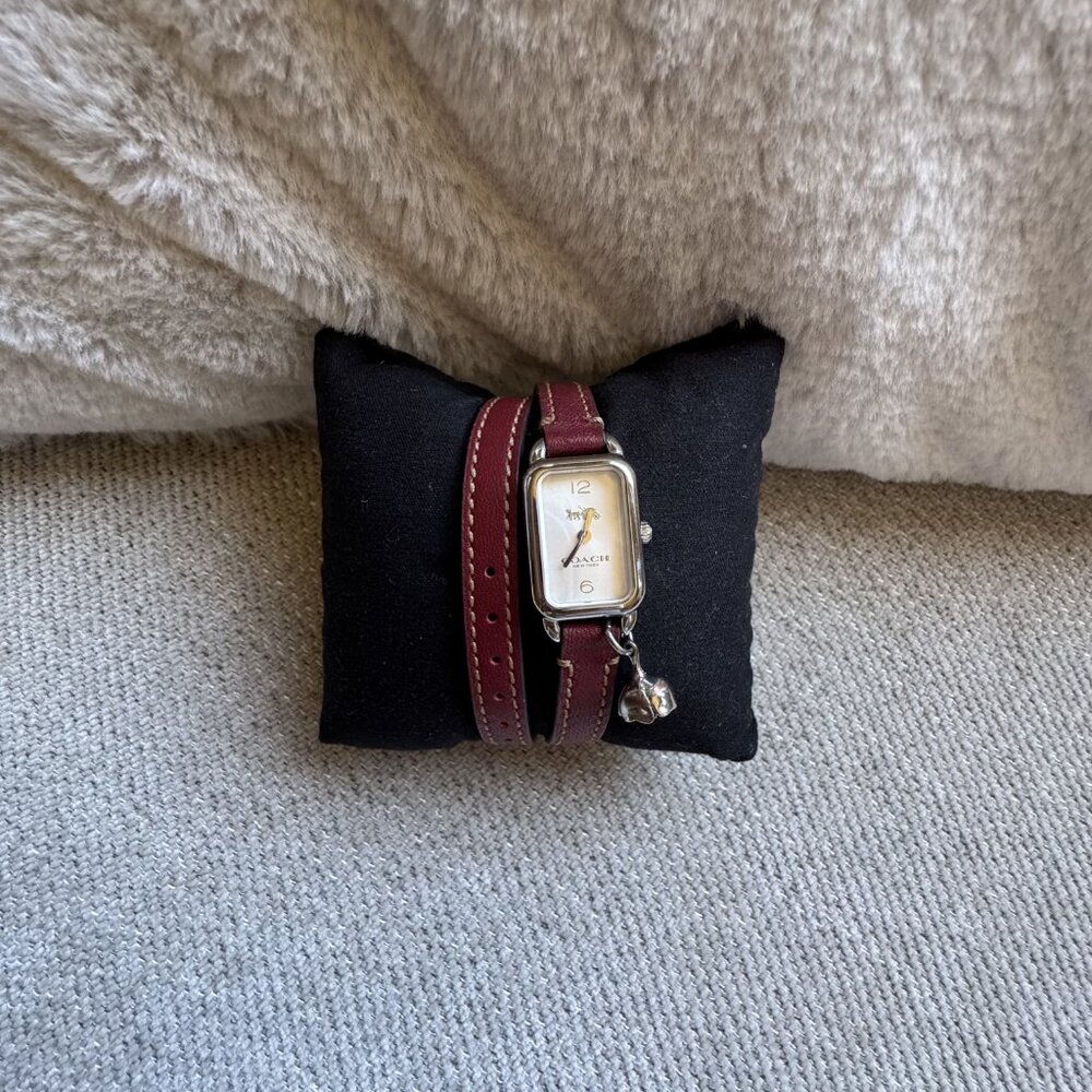 Coach women’s wrap leather strap watch “Delancey” with charm